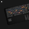 Adobe Graphic Designer Mac desk mat positioned with a keyboard, showcasing its practical design for designers and creatives.