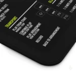 This studio setup features the Ableton Live desk mat alongside a MIDI controller and headphones, showing real-world usage.