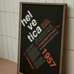 Helvetica poster on black background with modernist Swiss design composition.