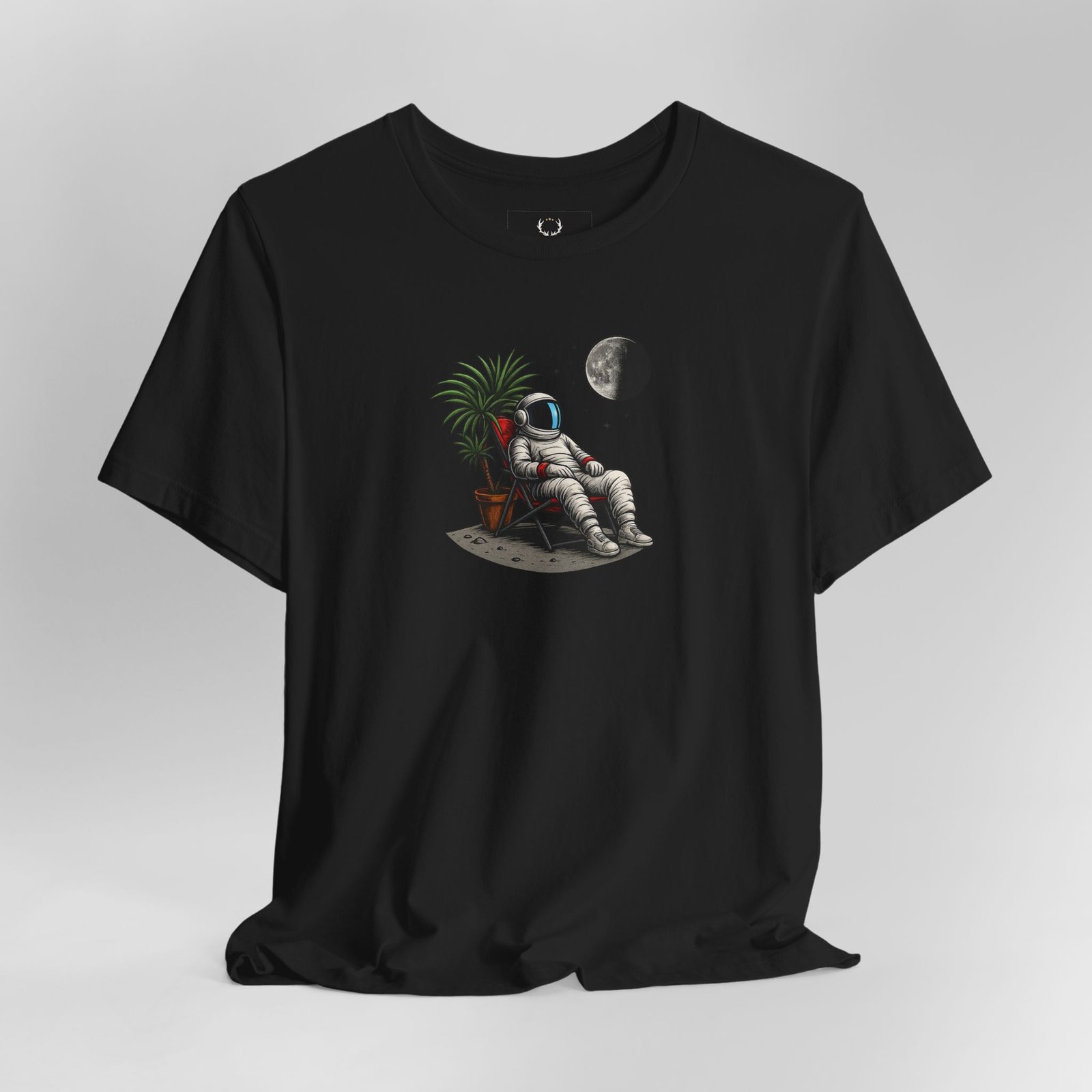 Astronaut Relaxing T-Shirt with outer space chill vibes, cosmic moon, and astronaut artwork for streetwear fashion.
