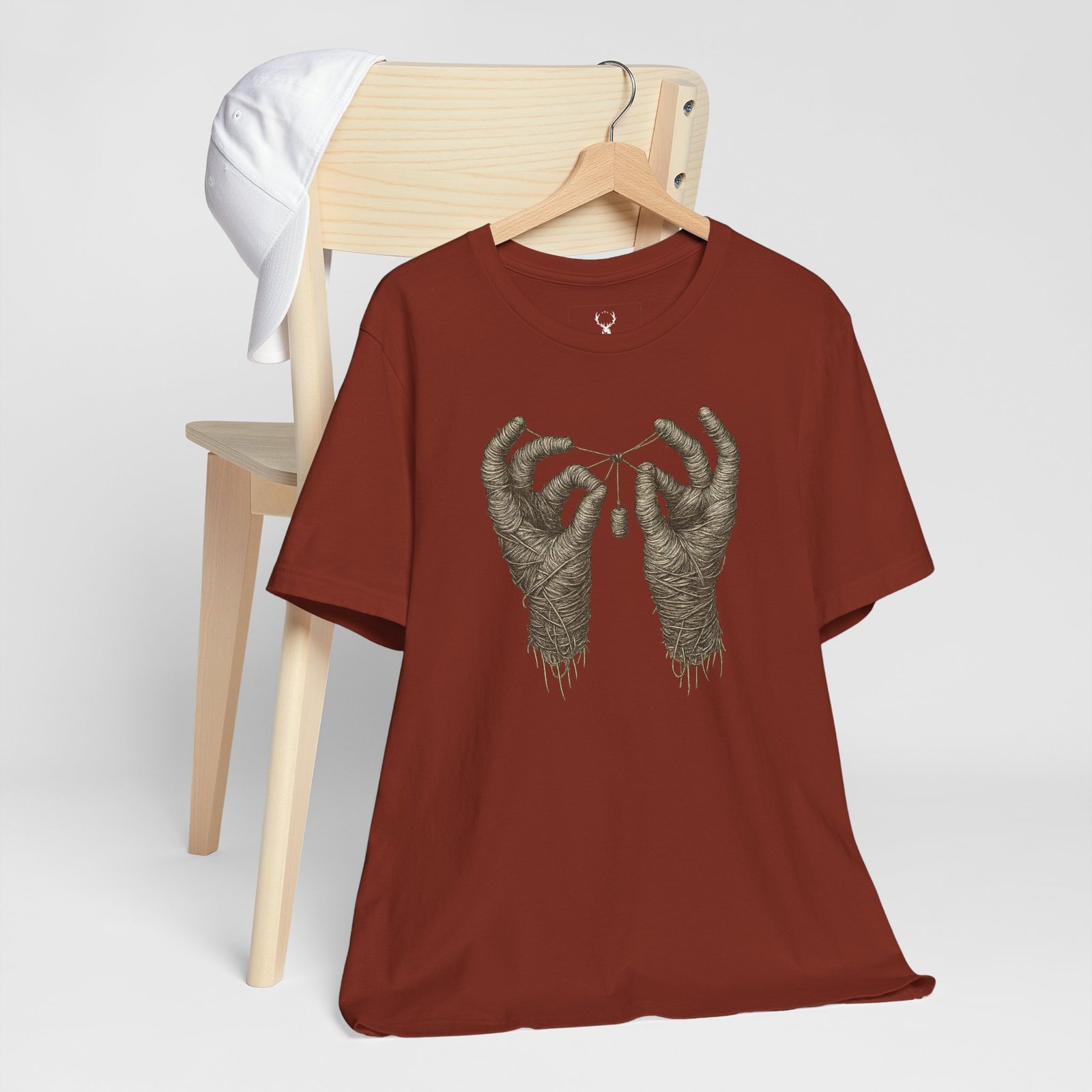 Gothic streetwear T-shirt with mummy hands illustration for EDM festivals, Halloween parties, and rave outfits.