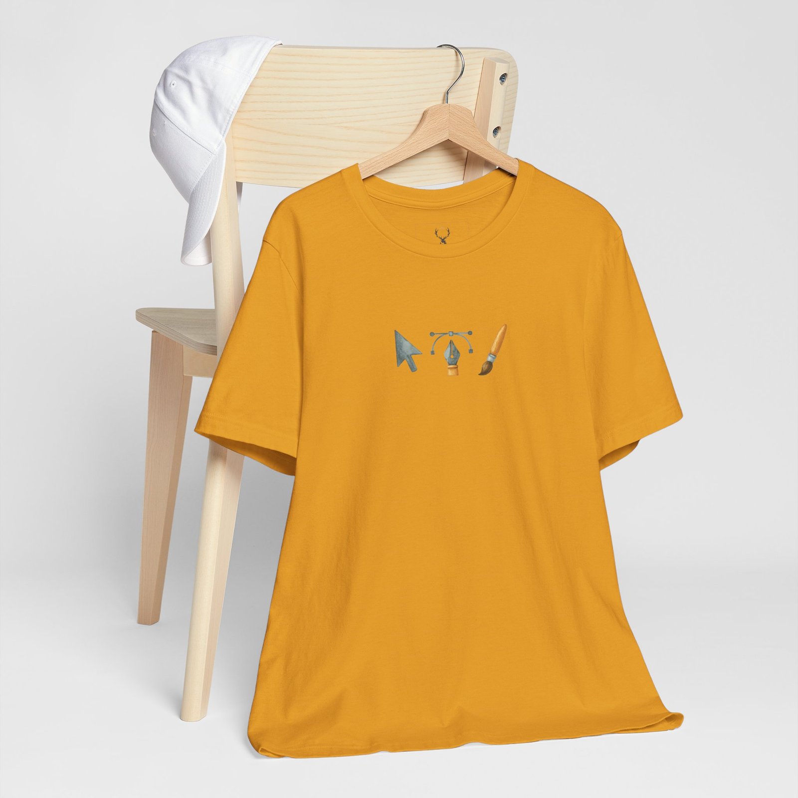 Ultra-soft designer icon t-shirt with subtle cursor, pen tool, and brush artwork; a neutral palette ensures this minimal art graphic tee layers under jackets and hoodies.