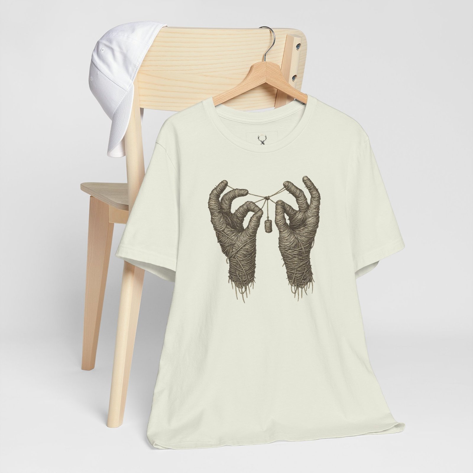 EDM streetwear T-shirt with mummy hands graphic, designed for ravers, DJs, and techno music fans worldwide.