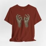 Festival streetwear T-shirt featuring creepy mummy hands artwork, blending gothic style with EDM rave culture.