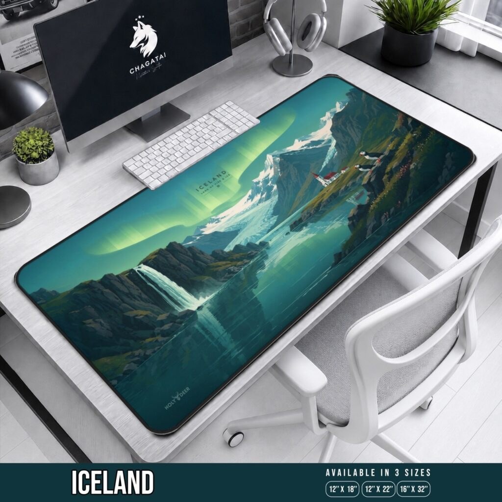Iceland Aurora Desk Mat with green northern lights above snowy mountains, a glacier, waterfall, red-roofed church, and puffins